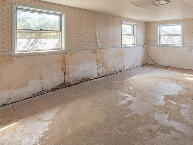 basement featuring wallpapered walls