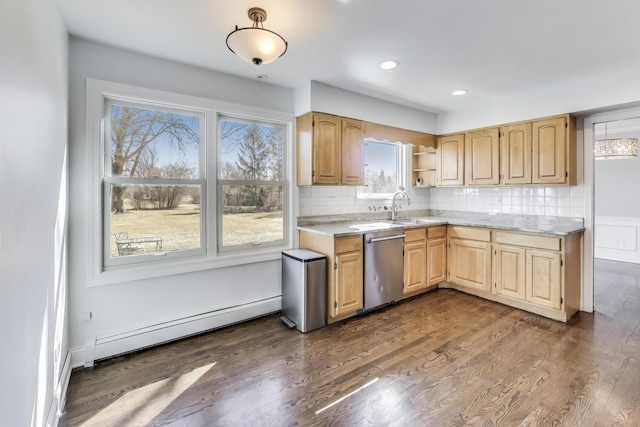 kitchen with backsplash, stainless steel dishwasher, light countertops, a baseboard radiator, and dark wood-style flooring