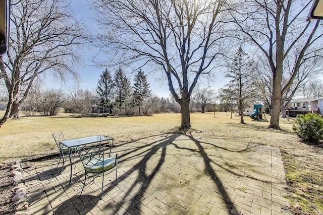 exterior space featuring playground community and a trampoline