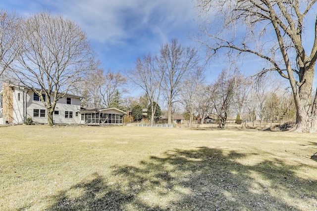 view of yard with a sunroom