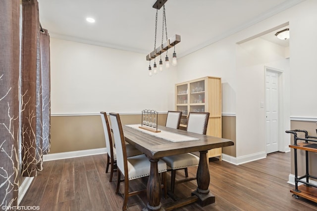 dining room featuring baseboards, crown molding, dark wood-type flooring, and recessed lighting