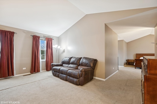 living area with vaulted ceiling, visible vents, baseboards, and light carpet
