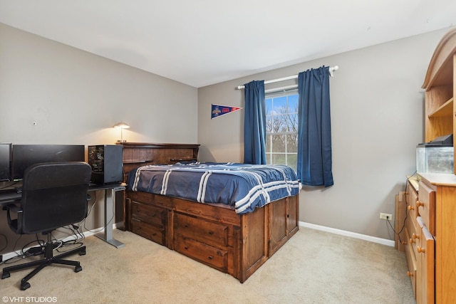 bedroom featuring light carpet and baseboards