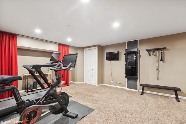 workout area featuring baseboards, carpet, and recessed lighting