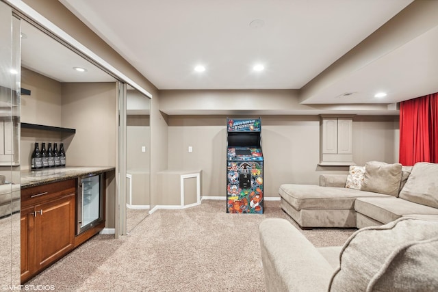 living area with recessed lighting, wine cooler, a dry bar, light carpet, and baseboards