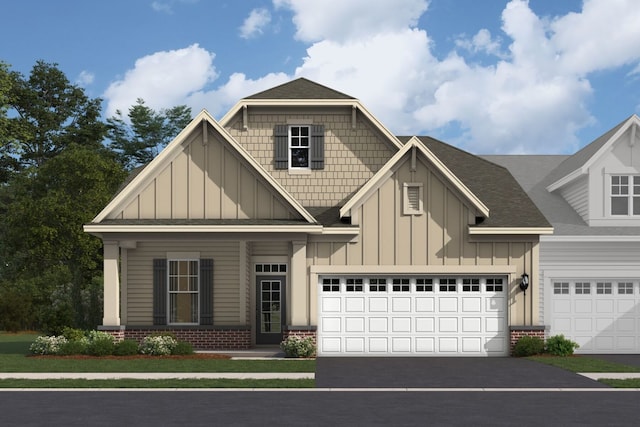 view of front of home featuring board and batten siding, brick siding, driveway, and a garage