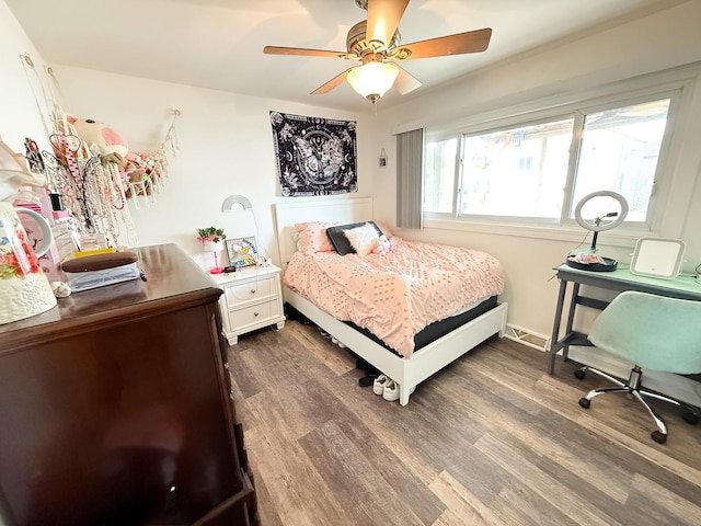 bedroom with baseboards, ceiling fan, visible vents, and dark wood-type flooring