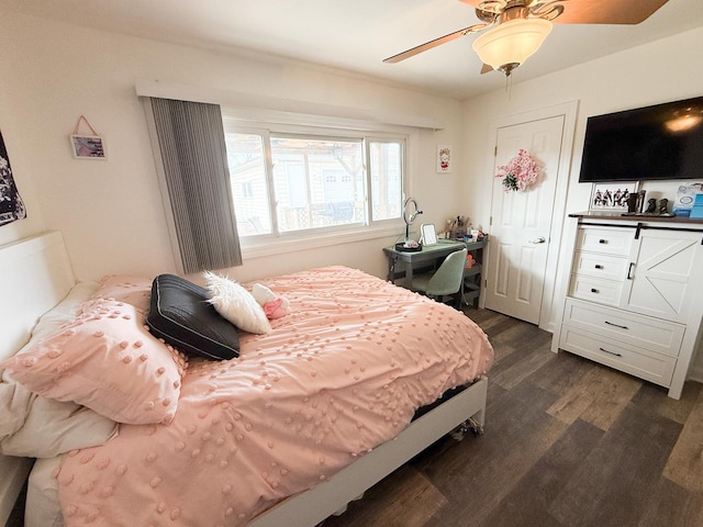 bedroom featuring a ceiling fan and dark wood-style flooring