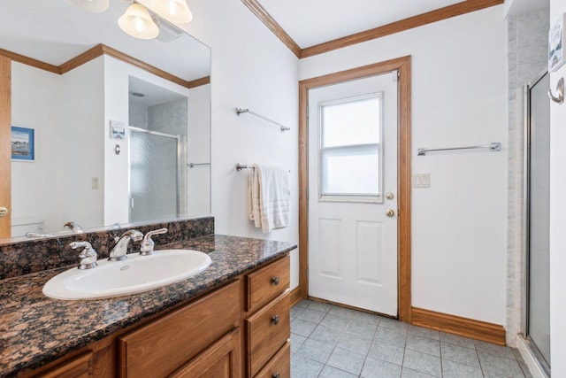 full bathroom with toilet, ornamental molding, a stall shower, tile patterned floors, and vanity