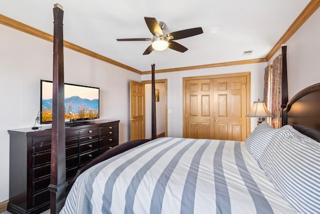 bedroom with ceiling fan, visible vents, a closet, and ornamental molding