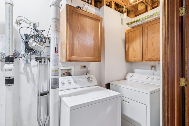 laundry area featuring cabinet space and independent washer and dryer