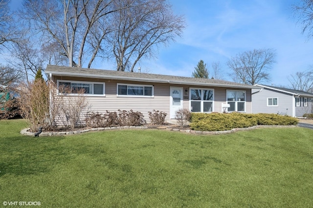 single story home with a front lawn