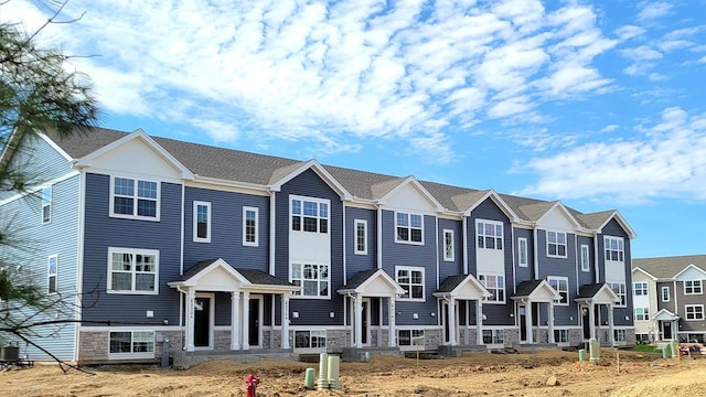 6570 Linden Trl Unit F, Wonder Lake, IL 60097 - townhome / multi-family property featuring stone siding and a front lawn