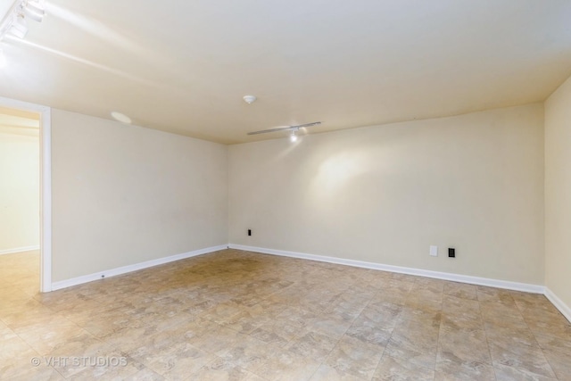 empty room with baseboards