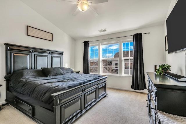 bedroom featuring light carpet, baseboards, visible vents, a ceiling fan, and vaulted ceiling