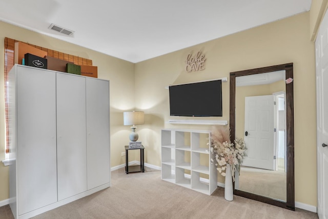 interior space featuring carpet, visible vents, and baseboards