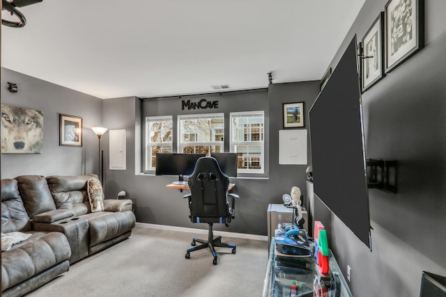 office space with carpet floors, visible vents, and baseboards