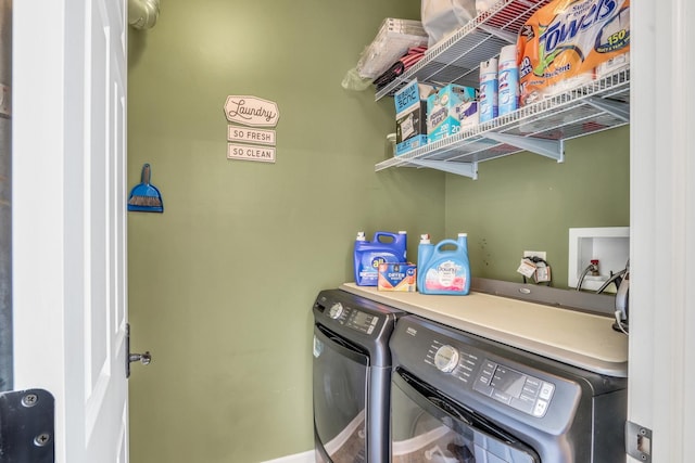 laundry area featuring laundry area and washer and clothes dryer