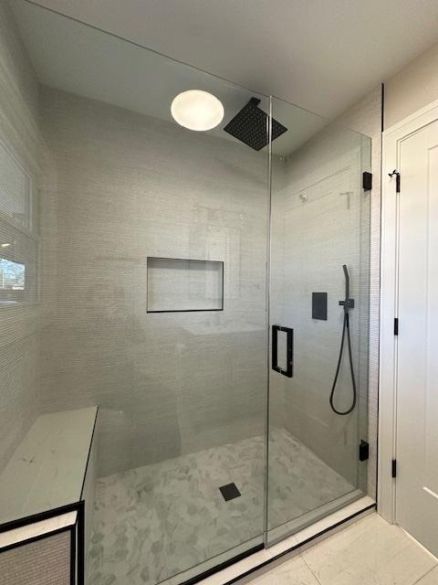 bathroom featuring a stall shower and tile patterned flooring