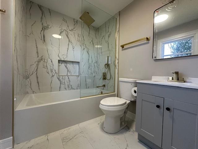 full bathroom featuring toilet, marble finish floor, vanity, and a combined bath / shower with rainfall shower