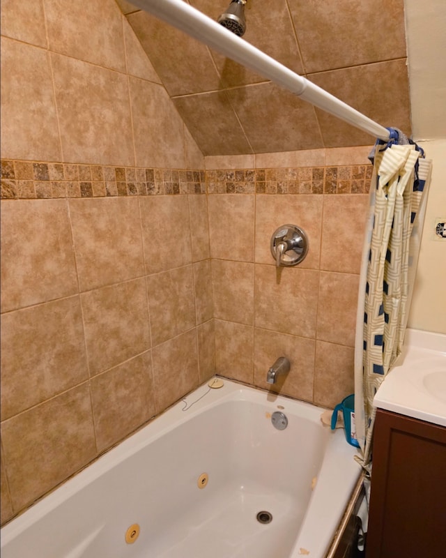 full bath featuring a combined bath / shower with jetted tub and vanity