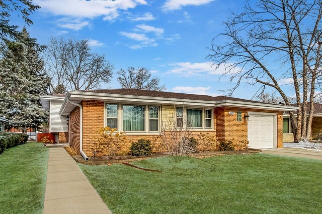 ranch-style home with an attached garage, brick siding, and a front yard