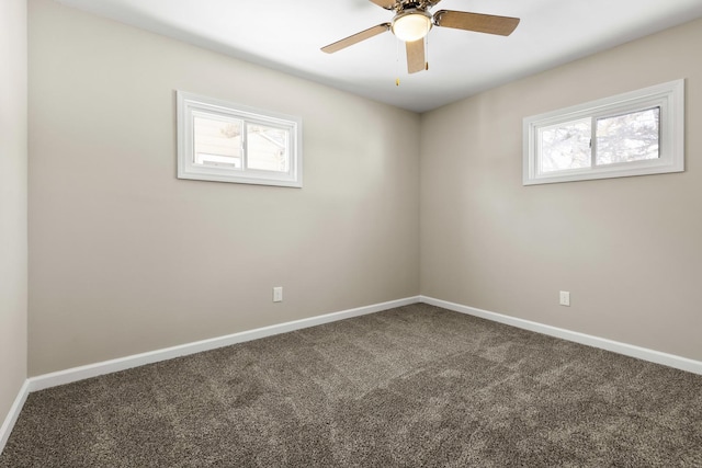 unfurnished room with carpet, baseboards, and a wealth of natural light