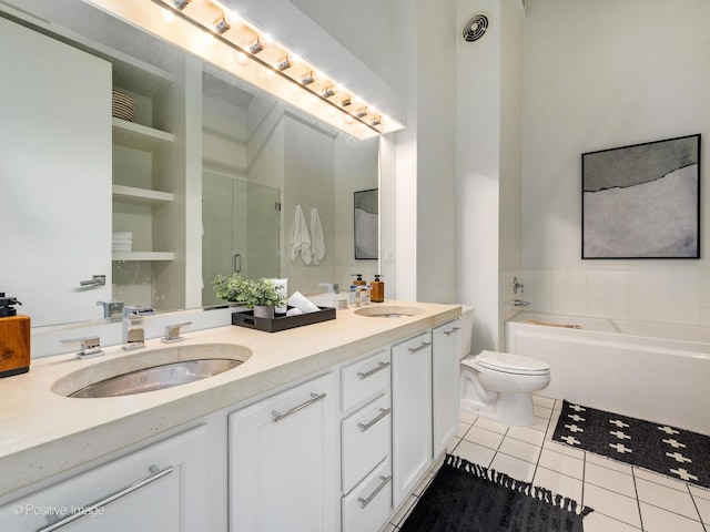 full bathroom featuring a stall shower, tile patterned flooring, a sink, and toilet