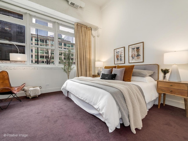 bedroom featuring carpet floors and baseboards