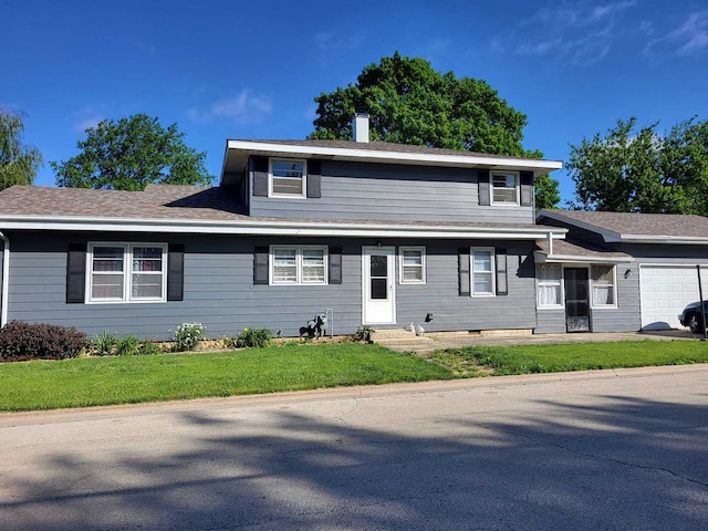 view of front of house with a garage, roof with shingles, a front lawn, and a chimney