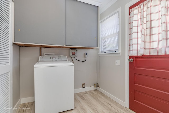 washroom with laundry area, washer / clothes dryer, wood finished floors, and baseboards