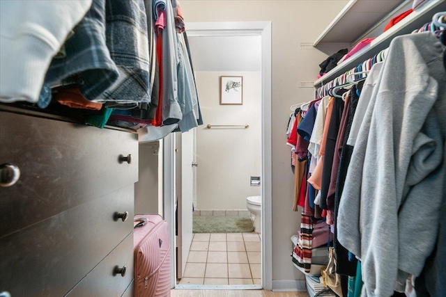 walk in closet featuring light tile patterned floors