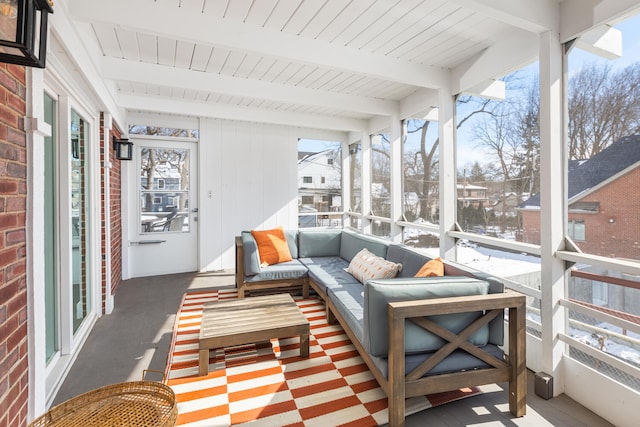 sunroom with wooden ceiling and beam ceiling