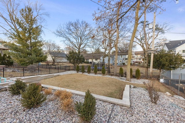 view of yard featuring a residential view and fence