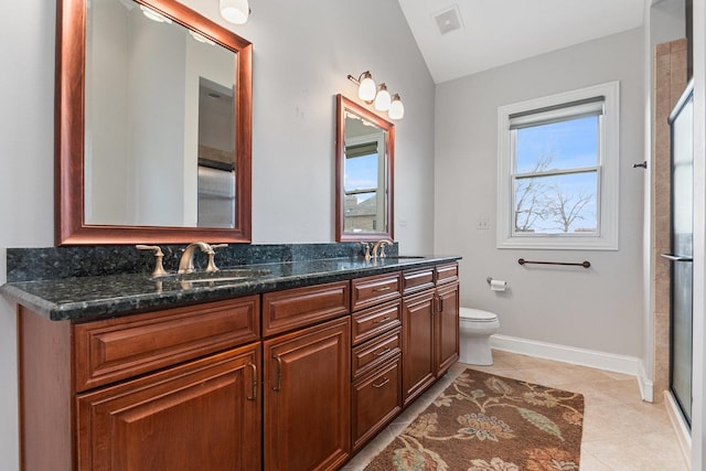 full bathroom with double vanity, visible vents, toilet, a sink, and tile patterned floors