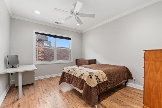 bedroom featuring light wood-style flooring, visible vents, baseboards, and ornamental molding