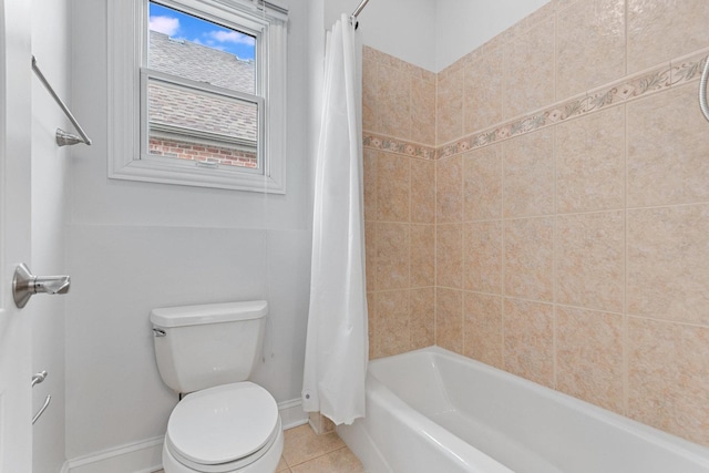 bathroom with shower / bath combination with curtain, baseboards, toilet, and tile patterned floors