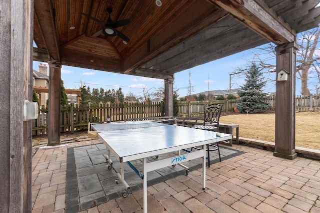 view of patio with a fenced backyard, outdoor dining area, and a ceiling fan