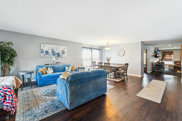 living area featuring hardwood / wood-style floors and baseboards