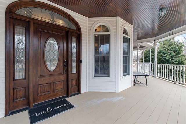 doorway to property featuring covered porch