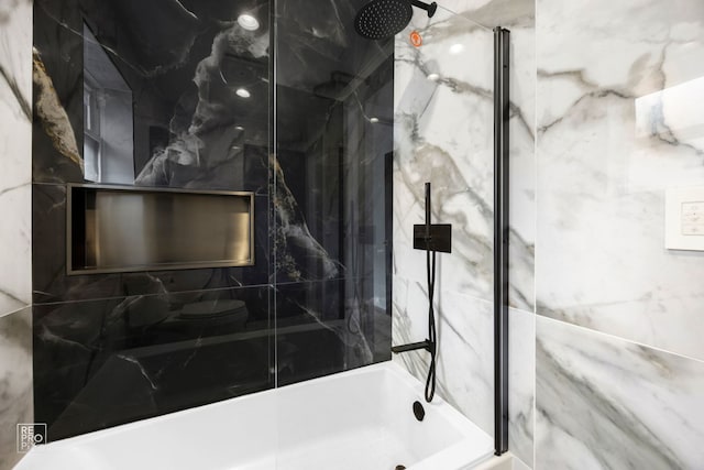 full bathroom featuring a marble finish shower