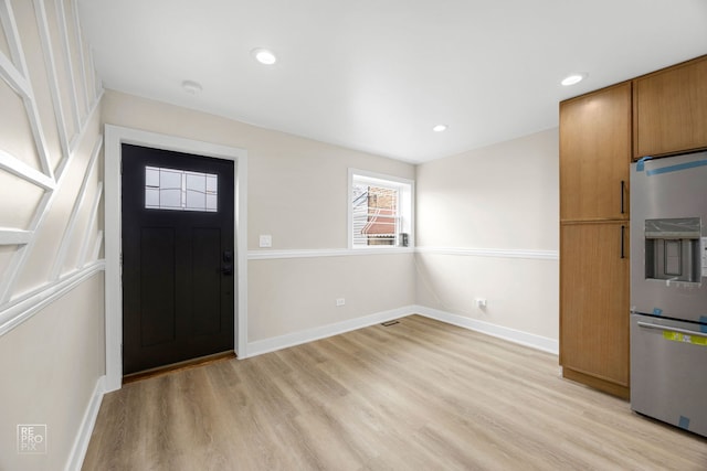 entryway featuring recessed lighting, light wood-style flooring, and baseboards