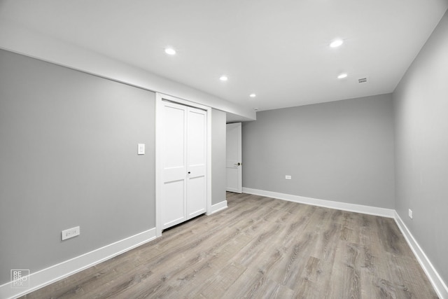 interior space featuring recessed lighting, light wood-style flooring, and baseboards