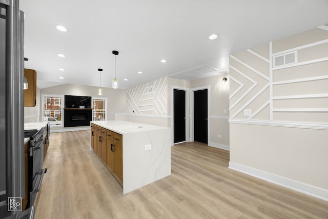 kitchen with a center island, visible vents, light wood finished floors, and recessed lighting