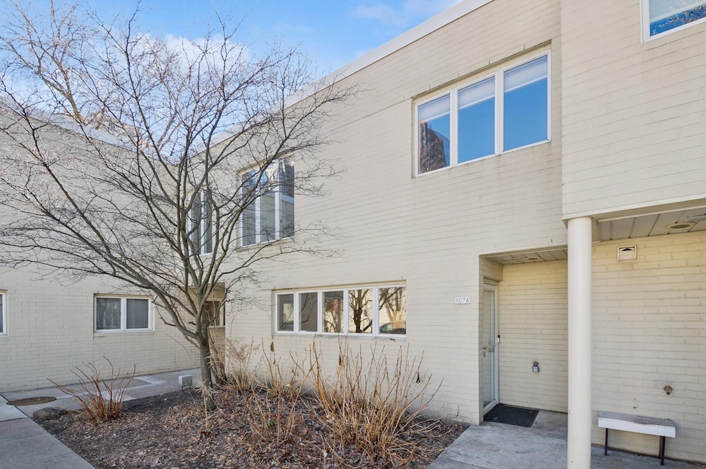 exterior space featuring brick siding