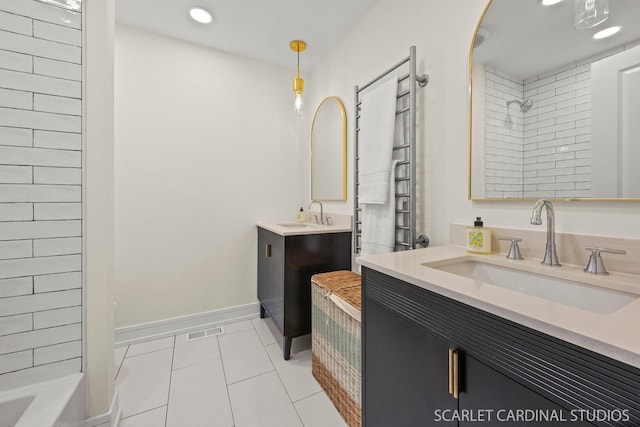 full bath with walk in shower, two vanities, a sink, and visible vents