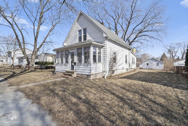 view of front of property featuring a sunroom