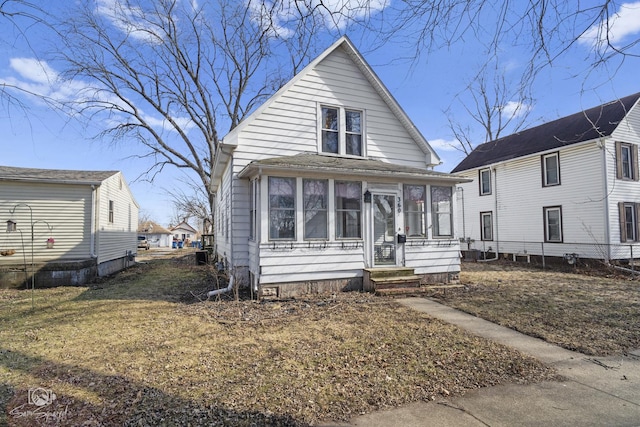 view of front of house featuring a sunroom