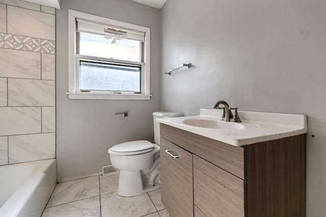 full bathroom featuring marble finish floor, vanity, and toilet