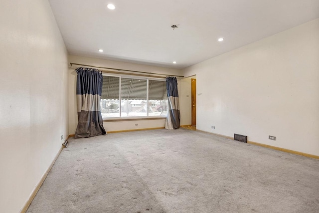 unfurnished room featuring carpet floors, baseboards, visible vents, and recessed lighting